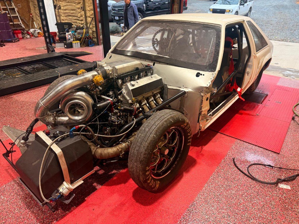 Turbo Mustang race car with the engine exposed