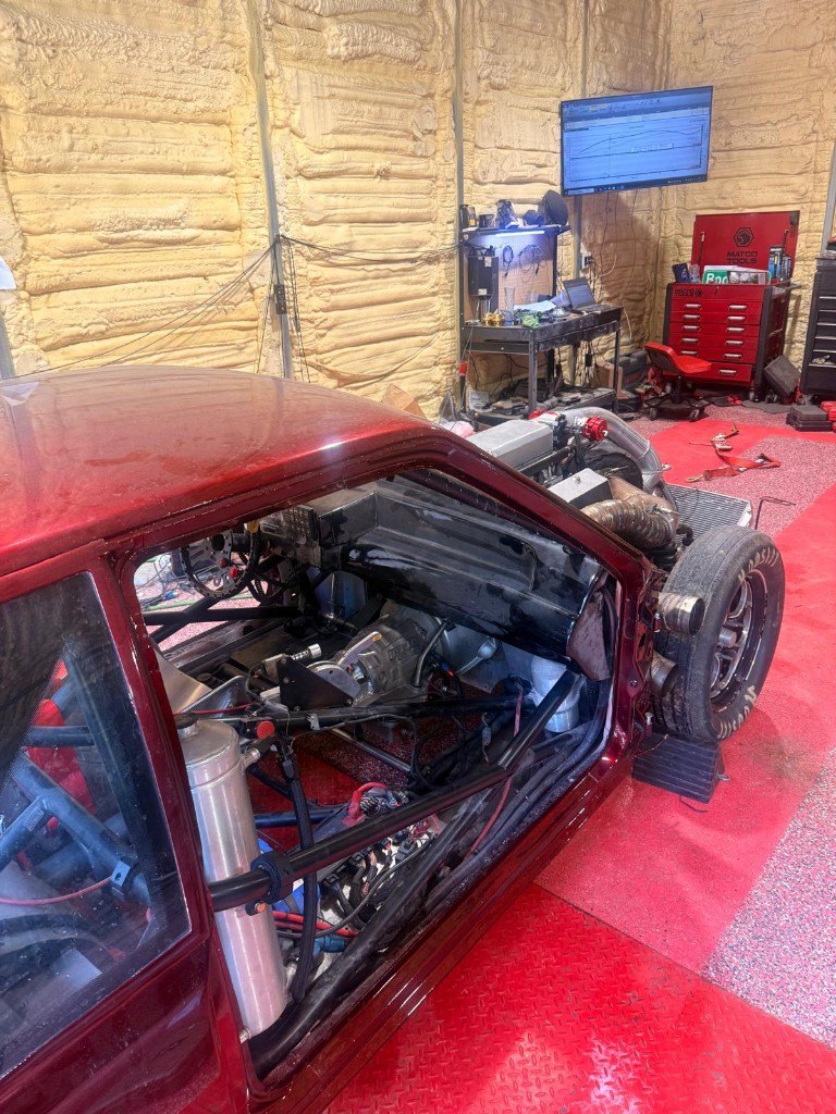 Caged race car interior on the dyno